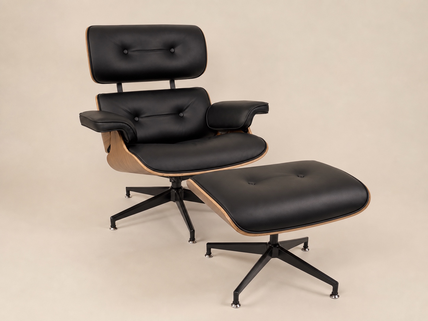 Black leather lounge chair and ottoman, three-quarter view