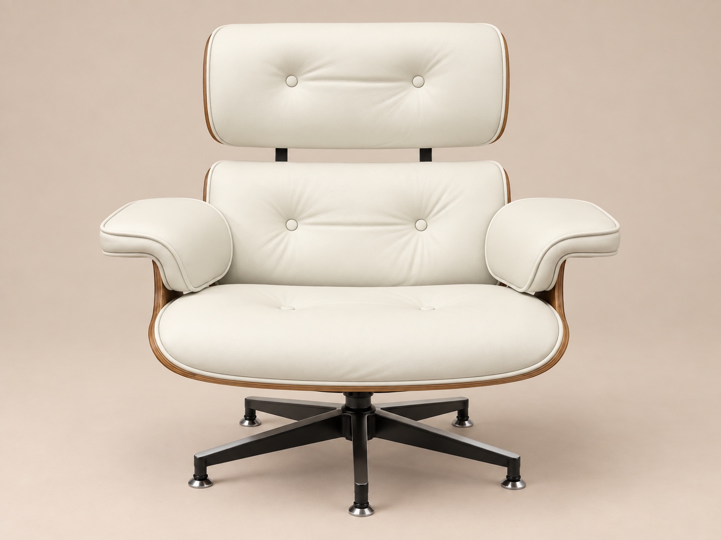 Front view of the white leather chair with button-tufted cushions