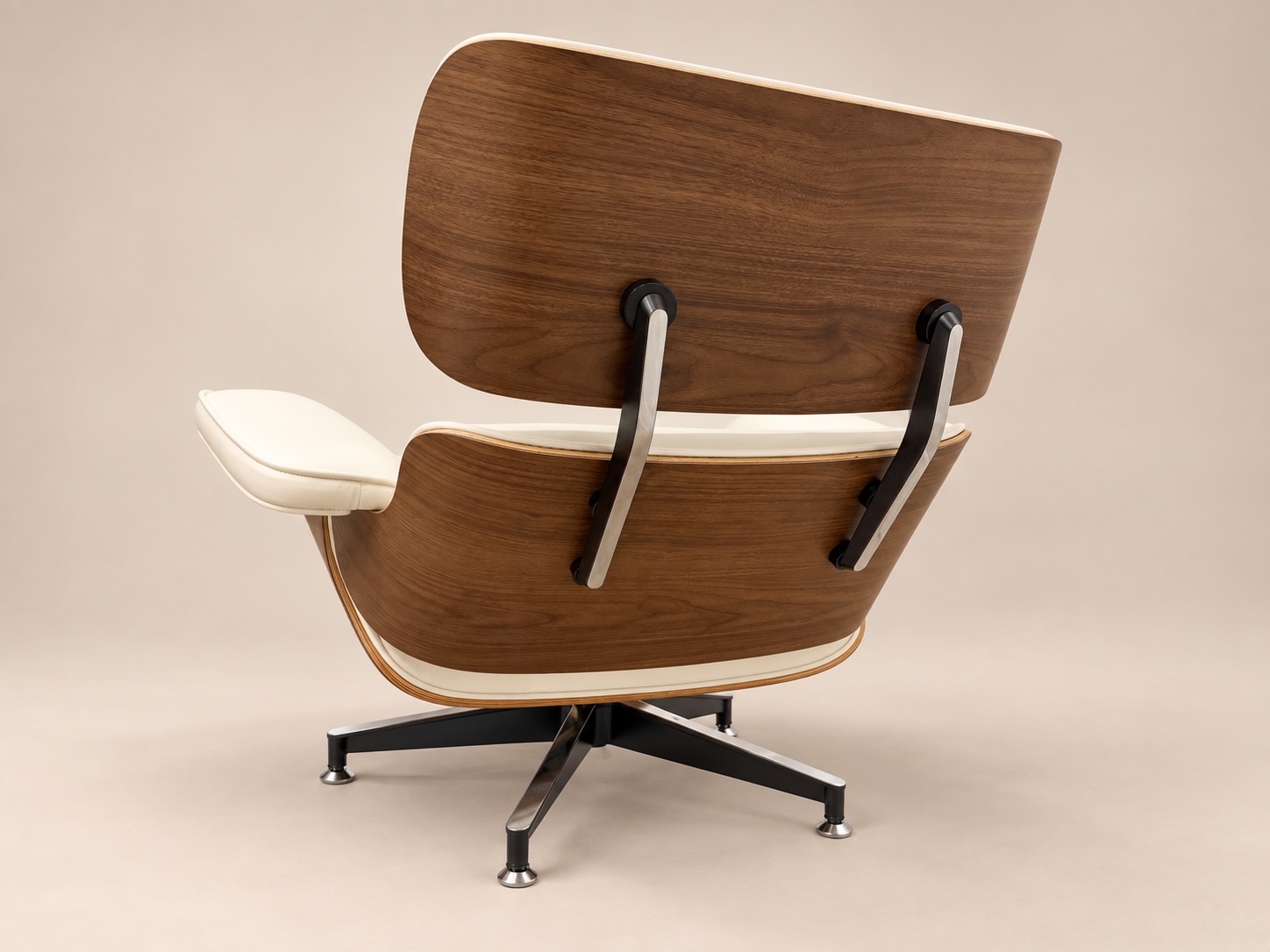 Rear walnut shells and metal back braces of the white leather chair